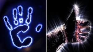 Kirlian photography handprint showing corona discharge patterns created by high-frequency electrical interaction around the fingers